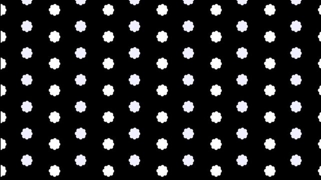 A dark background filled with a repeating pattern of small white flower like shapes evenly distributed