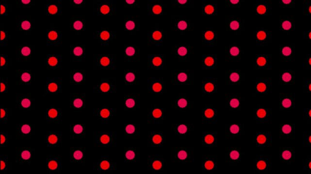 A black background with a pattern of alternating red and pink dots in a regular arrangement