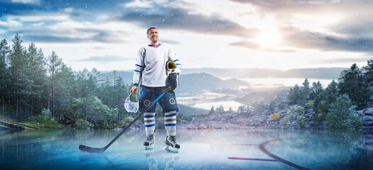 Hockey players in action on the ice. Outdoor game. Sports. Hockey match. A large hockey rink in the middle of an forest. Hockey concept. Panorama
