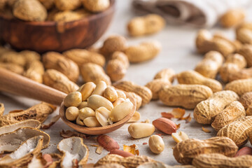Peanuts in shell. Groundnuts on kitchen table.