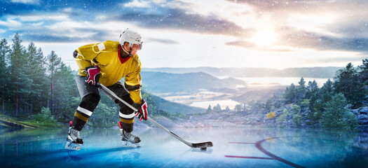 Hockey players in action on the ice. Outdoor game. Sports. Hockey match. A large hockey rink in the middle of an forest. Hockey concept. Panorama