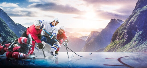 Hockey players in action on the ice. Outdoor game. Sports. Hockey match. A large hockey rink in the middle of an forest. Hockey concept. Panorama