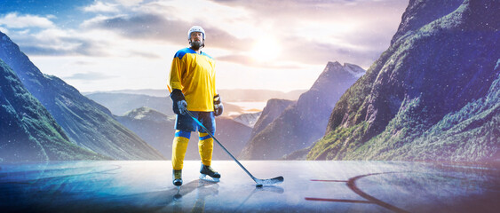 Hockey players in action on the ice. Outdoor game. Sports. Hockey match. A large hockey rink in the middle of an forest. Hockey concept. Panorama