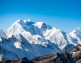 Fototapeta premium stunning view of majestic snow capped mountain peaks under a clear blue sky