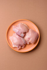 Chicken thigh fillet, skinless and boneless meat for grilling or barbecue. Chicken thigh fillet