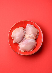 Chicken thigh fillet, skinless and boneless meat for grilling or barbecue. Chicken thigh fillet