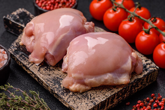 Chicken thigh fillet, skinless and boneless meat for grilling or barbecue. Chicken thigh fillet