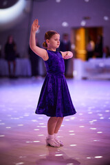 Children compete in ballroom dance event at a local venue