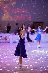 Children compete in ballroom dance competition at event