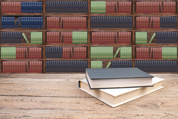 Books on the table in the library, against the background of wooden cabinets with books. Back to school. Education background. Copy Space.