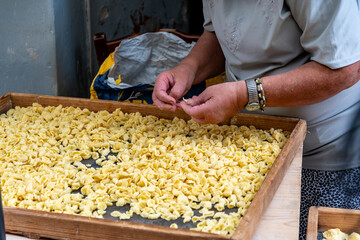Preparation of the traditional Apulian "orecchiette" in Strada Arco Basso, in old Bari