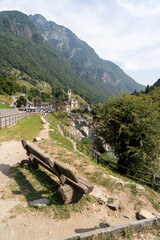 Lavertezzo, Switzerland - August 14, 2025: The charming village in Ticino, Switzerland, is famed for its crystal-clear Verzasca River, where people enjoy a refreshing dip in the cool water.