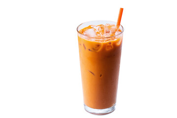 Refreshing glass of thai iced tea with orange straw