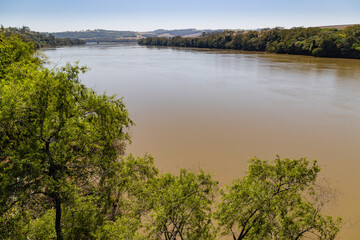 Ivaí River and bridge surrounded by countryside hills in southern Brazil