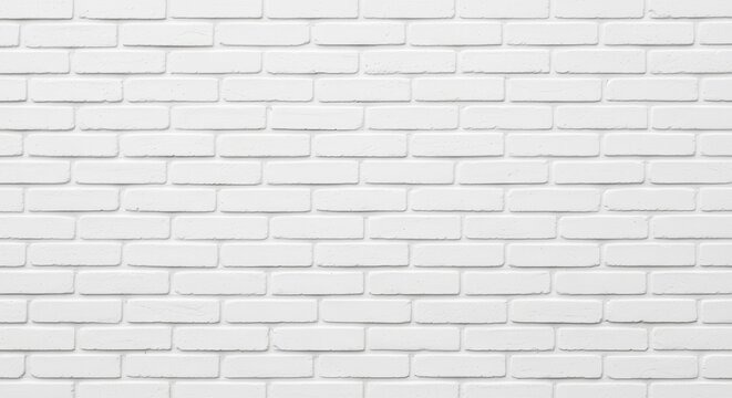 Clean white brick wall provides a modern, minimalist background for creative designs and stylish projects