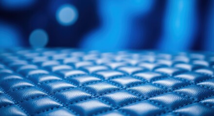 Fototapeta premium Elegant blue leather upholstery with diamond stitching creates a luxurious, modern aesthetic texture