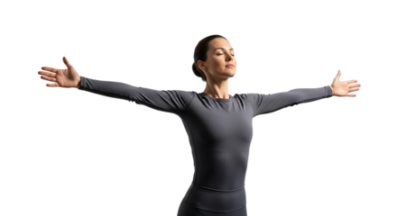Woman with arms outstretched, eyes closed, wearing gray sportswear, practicing yoga and meditation for relaxation and wellness