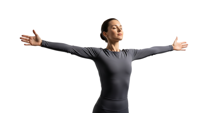 Woman with arms outstretched, eyes closed, wearing gray sportswear, practicing yoga and meditation for relaxation and wellness
