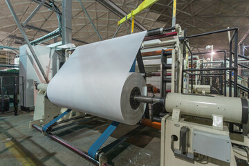 Specialized equipment for unwinding and winding rolls.