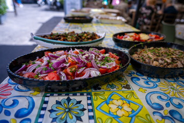 Fresh Italian dishes displayed at a vibrant outdoor market in Europe