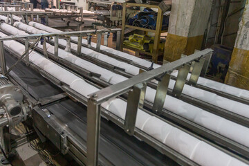 A conveyor belt at a toilet paper factory.