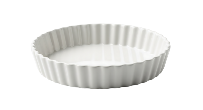 Empty white ceramic tart pan, perfect for baking delicious desserts and savory quiches in the kitchen