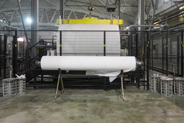 Jumbo rolls in a paper factory workshop.