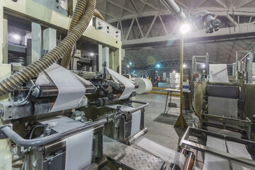 A napkin production line in a large workshop.