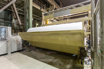 Jumbo rolls in a paper factory workshop.