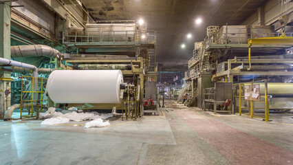 Jumbo rolls in a paper factory workshop.