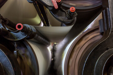 The dry paper web enters the drying section, which consists of steam-heated cylinders.