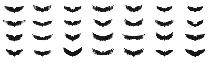 Set of black bat silhouettes in various flight positions.