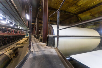 Jumbo rolls in a paper factory workshop.