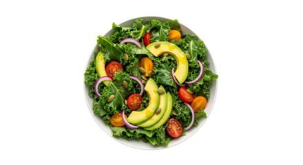 Overhead shot of a vibrant kale salad, featuring fresh avocado, cherry tomatoes, red onion, and pumpkin seeds