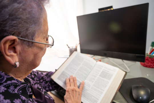 Faith-based psychologist referencing Bible in therapy planning - Powered by Adobe