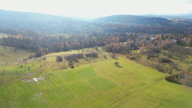 Rural Foothill Settlement in Autumn Colors, Aerial View of Houses and Fields.  Rabka-Zdr&oacute;j, Poland