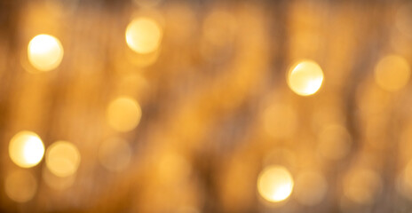 Fototapeta premium Soft Golden Bokeh Lights Create a Warm Abstract Background for Luxury, Festive, and Celebration Uses
