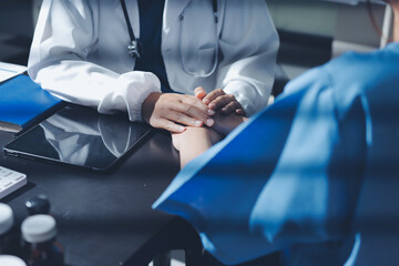 Male doctors shake hands with patients encouraging each other and praying for blessings. To offer love, concern, and encouragement while checking the patient's health. concept of medicine
