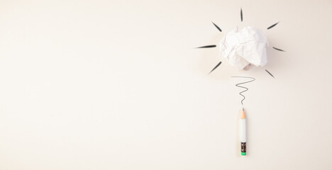 white blank paper sheet, crumpled paper ball and bulb with pencil on the wall. creative idea, inspiration, creativity, inspiration concept