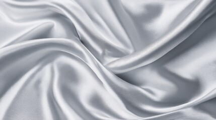 Obraz premium Soft shiny fabric swirls beautifully creating gentle curves and reflecting light.