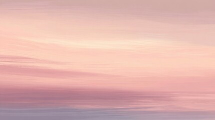 Obraz premium A gentle blend of pink and lavender fills the sky as day transitions to night evoking peace.