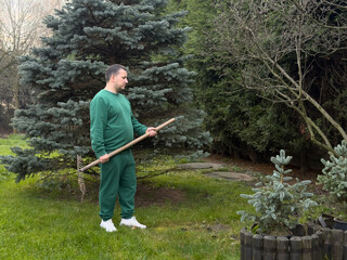 Man gardening in green attire