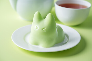 Vanilla apple panna cotta in the form of cat in a plate