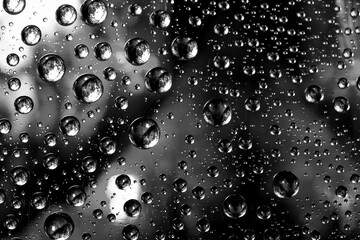 Abstract background texture drops of water and art light on glass. Creative space design