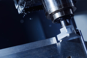 Precision cnc milling machine in operation with metal workpiece