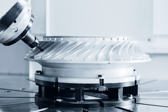 Precision cnc milling machine crafting turbine wheel in modern workshop