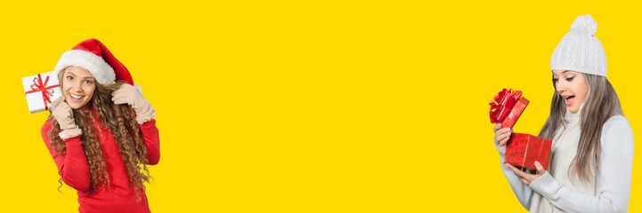 Girl in santa hat with gifts box