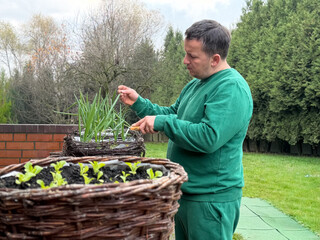 Man tending to plants in a garden