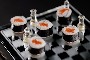Fashion food Creative sushi arrangement on glass chessboard with chess pieces
