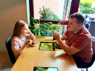 Family enjoying dessert together at home